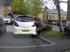 Watch the hair-raising moment woman tries to stop her runaway car smashing into her neighbour's house