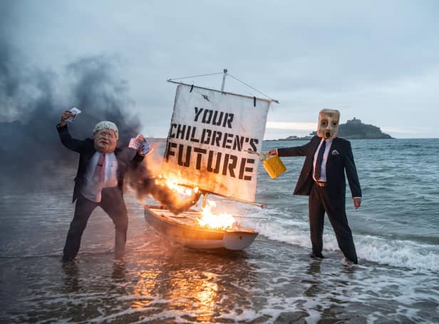 Ocean Rebellion protesting against the UK's continued investment in fossil fuels.