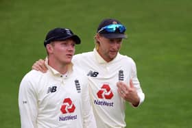 England captain Joe Root with spinner Dom Bess (left).