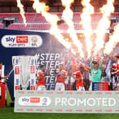 Chris Maxwell of Blackpool lifts the Sky Bet League One Play-off Trophy as his team mates celebrate following victory in the Sky Bet League One Play-off Final match between Blackpool and Lincoln City at Wembley Stadium on May 30, 2021 in London, England. (Photo by Catherine Ivill/Getty Images)