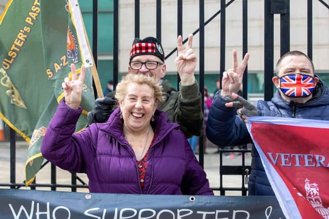 Supporters of Soldier A and Soldier C react after the case against the two former paratroopers collapsed at the High Court in Belfast on May 4, 2021.
