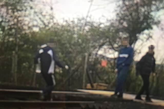Two boys are pictured walking down the tracks at Bewbush (Network Rail)
