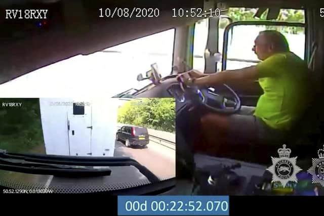 Footage of truck driver Derek Holland using his mobile phone before crashing into the back of a van (Photo: SWNS)
