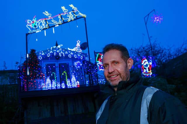 The local council has told Mark Strong, who owns the balcony which is covered in Christmas lights, to take it down


