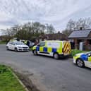 Police presence after officers find the remains of a baby and a house in Wigan