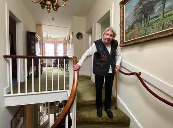 The remarkable Margaret Payne on the stairs of her home in Ardvar, Sutherland. Picture: PA Wire
