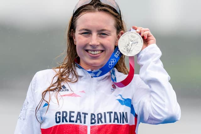 Great Britain's Georgia Taylor-Brown celebrates with her silver medal after the Women's Triathlon at the Odaiba Marine Park on the fourth day of the Tokyo 2020 Olympic Games in Japan (PA)
