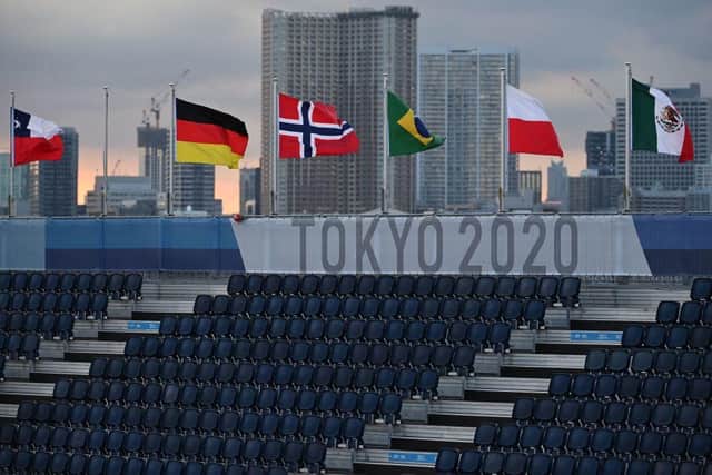 Various national flags flutter in the wind at the venue of the beach volleyball competition during the Tokyo 2020 Olympic Games at Shiokaze Park (Photo: ANGELA WEISS/AFP via Getty Images)