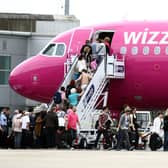 Passengers getting on a Wizz Air plane at Luton Airport. Picture: Steve Parsons/PA Wire