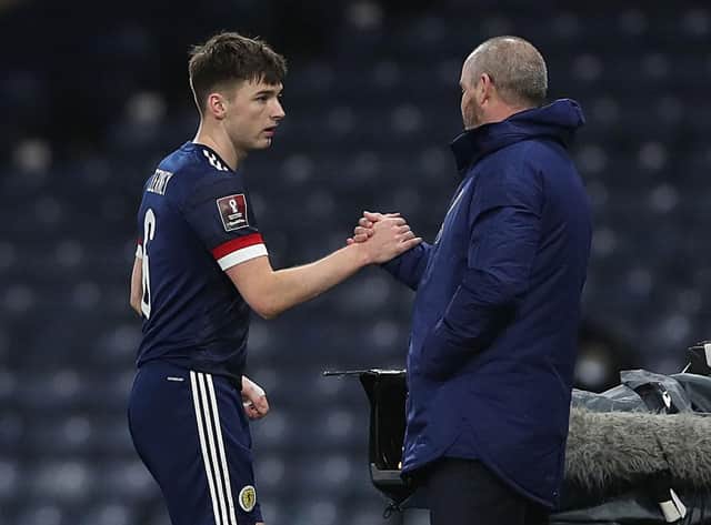 Scotland manager Steve Clarke interacts with Kieran Tierney of Scotland as he leaves the field after setting up three goals against Faroe Islands.