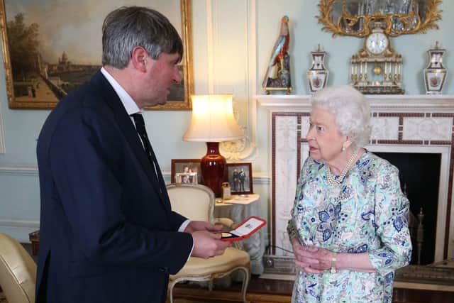 LONDON, ENGLAND - MAY 29: Queen Elizabeth II presents Simon Armitage with The Queen's Gold Medal for Poetry upon his appointment as Poet Laureate during an audience at Buckingham Palace on May 29, 2019 in London, England. (Photo by Jonathan Brady - WPA Pool/Getty Images)