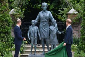 Britain's Prince William, Duke of Cambridge (L) and Britain's Prince Harry, Duke of Sussex unveil a statue of their mother, Princess Diana at The Sunken Garden in Kensington Palace, London on July 1, 2021, which would have been her 60th birthday. - Princes William and Harry set aside their differences on Thursday to unveil a new statue of their mother, Princess Diana, on what would have been her 60th birthday. (Photo by Dominic Lipinski / POOL / AFP) (Photo by DOMINIC LIPINSKI/POOL/AFP via Getty Images)