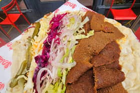 Two rival takeaways are rowing over who was first to offer the UK's 'first' vegan doner kebab cooked on a spit - only for meat lovers to dismiss both as 'not kebabs anyway'.