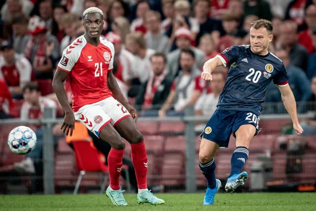 Denmark's Mohamed Daramy fights for the ball with Scotland's Ryan Fraser during the FIFA World Cup Qatar 2022 qualification football match between Denmark and Scotland in Copenhagen