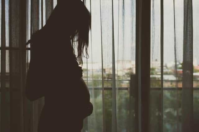 Silhouette of pregnant woman in the bedroom. (picture: Shutterstock)