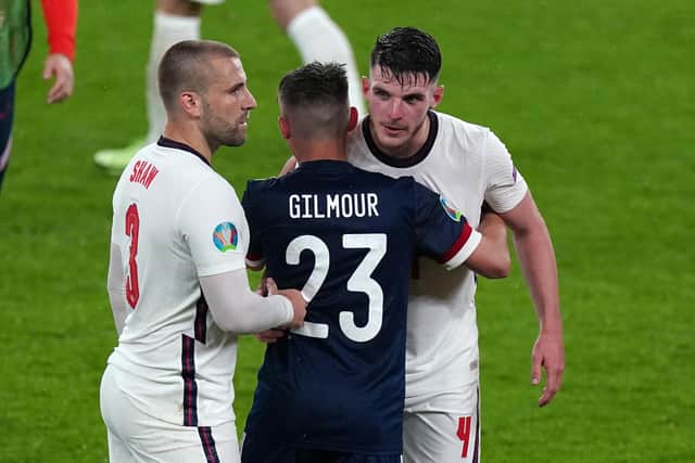 England's Luke Shaw (left) and Declan Rice embrace Scotland's Billy Gilmour after the UEFA Euro 2020 Group D match at Wembley Stadium.