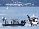 Police boats taking part in the rescue operation in the Firth of Clyde near Greenock (Pic:: Jane Barlow/PA Wire)