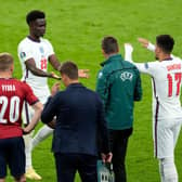 Jadon Sancho of England interacts with team mate Bukayo Saka after he replaced him as substitute against Czech Republic.