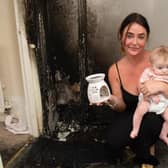Vikki Henvey with her daughter Tilly in her flat, which has been damaged beyond repair by a fire caused by an exploding wax melt burner (Photo: SWNS)