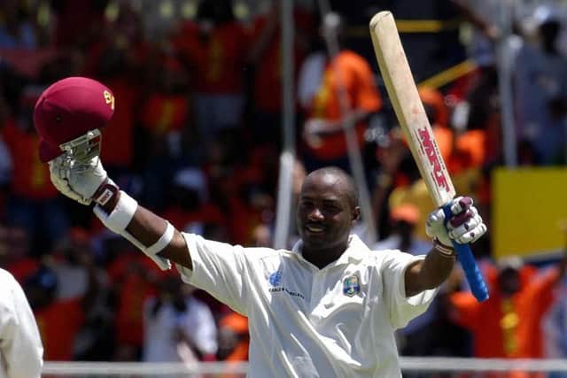 Brian Lara celebrates becoming the first man in history to score 400 in a Test innings against England in 2004. Pic: Gordon Brooks/AFP via Getty Images.