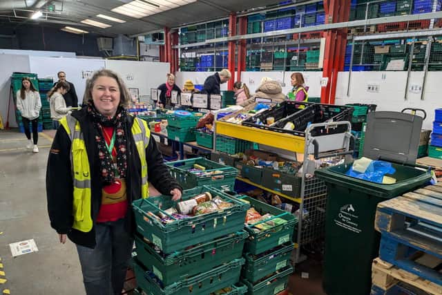 Foodbank Manager Dee Ward helps supervise the Open Day.