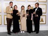 (L-R) Peter Spears, Frances McDormand, Chloe Zhao, Mollye Asher, and Dan Janvey accepted their awards for Best Picture for "Nomadland,"  at the Oscars on Sunday, 25 April 2021 (Picture: Getty Images)
