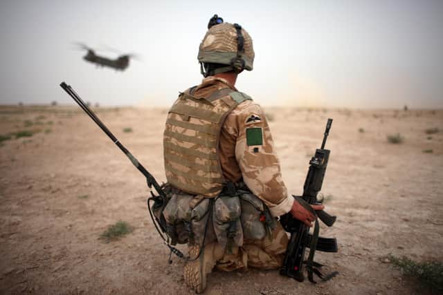 A British Army soldier from the 3rd Battalion The Parachute Regiment secures the helicopter landing strip (HLS) in 2008 during operation Southern Beast in Kandahar Province, Afghanistan (Photo by Marco Di Lauro/Getty Images)