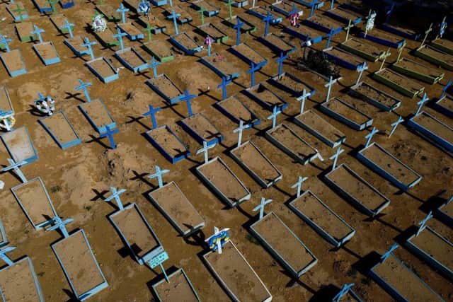 Aerial view of the graves of COVID-19 victims at the Nossa Senhora Aparecida cemetery in Manaus, Amazon state, Brazil, on April 15, 2021. Global death toll from Covid-19 passes 3 million people (Photo by MICHAEL DANTAS/AFP via Getty Images)