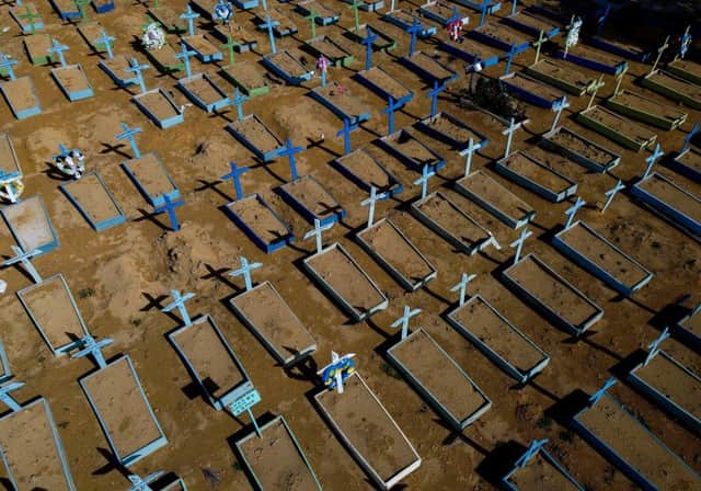 Aerial view of the graves of COVID-19 victims at the Nossa Senhora Aparecida cemetery in Manaus, Amazon state, Brazil, on April 15, 2021. Global death toll from Covid-19 passes 3 million people (Photo by MICHAEL DANTAS/AFP via Getty Images)