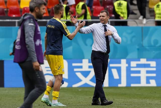 Ukraine's coach Andrey Shevchenko (R) celebrates with Ukraine's forward Andriy Yarmolenko after winning the UEFA EURO 2020 Group C football match between Ukraine and North Macedonia at the National Arena in Bucharest on June 17, 2021. (Photo by Robert Ghement / POOL / AFP) (Photo by ROBERT GHEMENT/POOL/AFP via Getty Images)