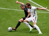 Germany's defender Robin Gosens (L) vies for the ball with England's forward Harry Kane during the UEFA EURO 2020 round of 16 football match between England and Germany at Wembley Stadium in London on June 29, 2021. (Photo by MATTHEW CHILDS / POOL / AFP) (Photo by MATTHEW CHILDS/POOL/AFP via Getty Images)