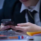 A blanket ban on mobile phones in English schools ditched in Government U-turn (Photo by Matt Cardy/Getty Images)