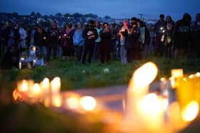 Members of the public attend a vigil for the victims of the mass shooting in Keyham, Plymouth (Picture: Ben Birchall/PA).