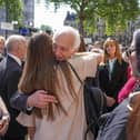 Chairman of the infected blood inquiry Sir Brian Langstaff with victims and campaigners outside Central Hall in Westminster, London, after the publication of the Inquiry report. Picture: Jeff Moore/PA Wire