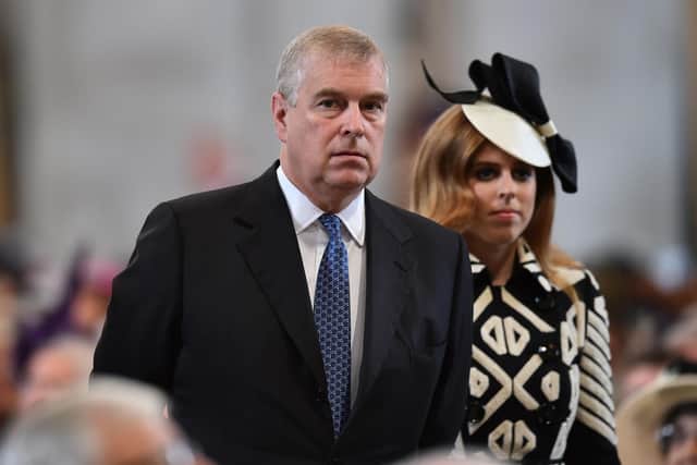 Prince Andrew, Duke of York pictured with his daughter Princess Beatrice at a service of thanksgiving for Queen Elizabeth II's 90th birthday at St Paul's cathedral on June 10, 2016. (Ben Stansall - WPA Pool/Getty Images)