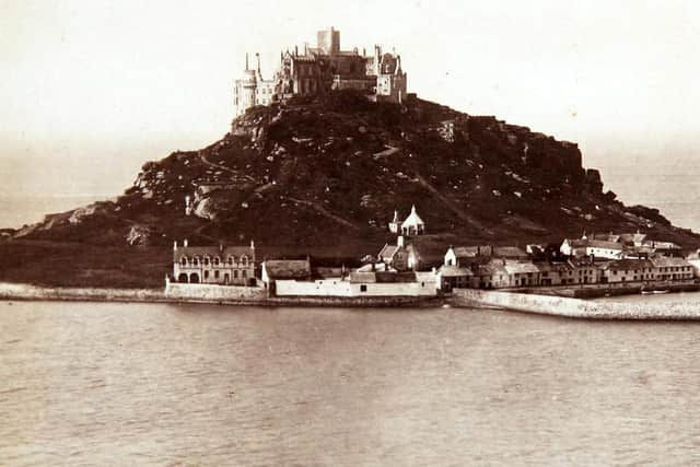 One of the earliest known pictures of St Michael's Mount, Penzance, Cornwall, taken in 1900 (SWNS).