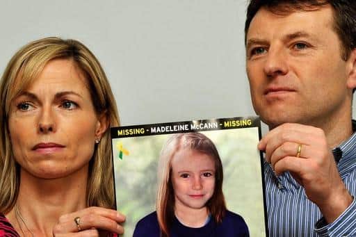 Madeleine McCann's parents, Kate and Gerry, with an age progression photo of the missing girl