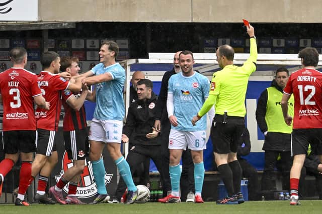 Larne’s Chris Gallagher is awarded a red card for a tackle on Elliot Dunlop. (Photo by INPHO/Stephen Hamilton)
