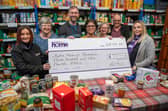Platform representative presenting the donation to members of the HOPE Nottingham team
