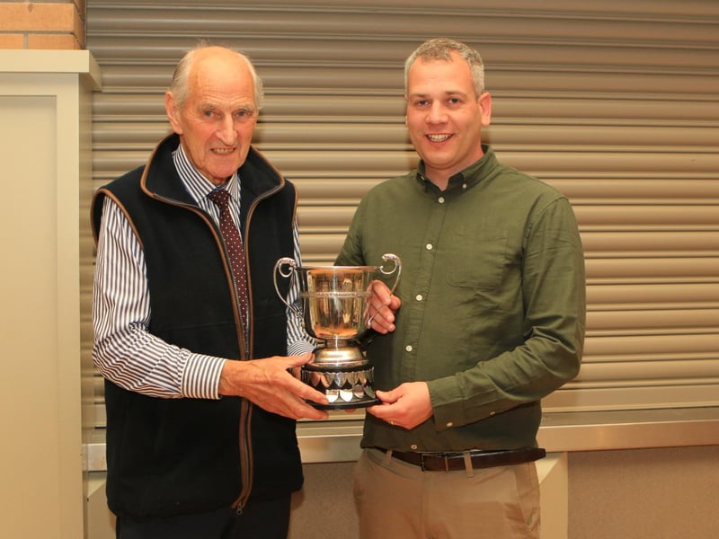Sean Burns, pictured with chairman Shane McDonald, receiving the Bruces Hill Cattle Company Trophy for the Overall Champion Animal at the club May sale for Longbeach Rocky.