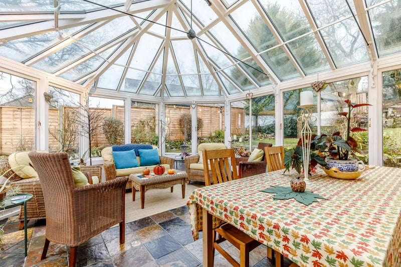 The original farmhouse features a conservatory with large centre island