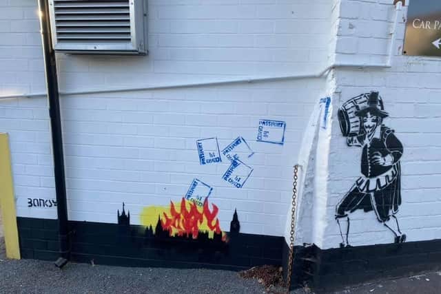 Guy Fawkes throwing Covid passports into the flames of a fire on the side of the Guy Fawkes Arms pub in the Harrogate district. (Picture by Charles Mackenzie)