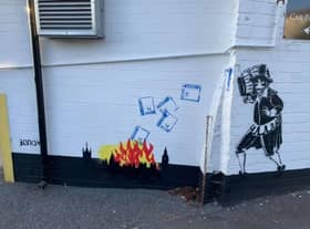 Guy Fawkes throwing Covid passports into the flames of a fire on the side of the Guy Fawkes Arms pub in the Harrogate district. (Picture by Charles Mackenzie)