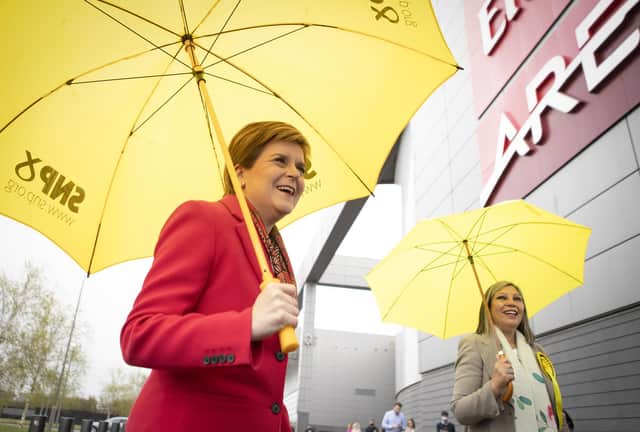 First Minister Nicola Sturgeon (left) with Scotland's first female MSP of colour, Kaukab Stewart, outside the Emirates Arena, Glasgow (Photo: Jane Barlow / PA)