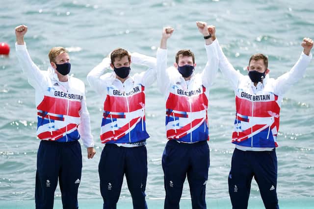 Great Britain's Harry Leask, Angus Groom, Tom Barras and Jack Beaumont collect their silver medals for the Men's Quadruple Sculls during the Rowing on July 28 (PA)