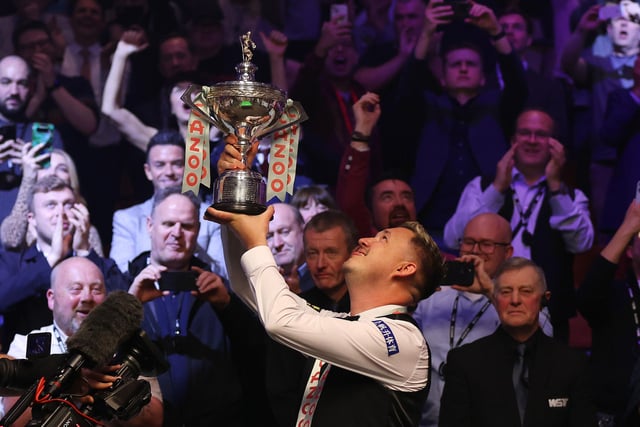 Kyren Wilson lifts the Cazoo World Snooker Championship trophy