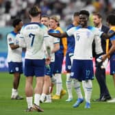England's Bukayo Saka with Jack Grealish following the FIFA World Cup Group B match at the Khalifa International Stadium, Doha.
