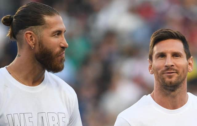 Sergio Ramos and Lionel Messi. (Photo by BERTRAND GUAY/AFP via Getty Images)