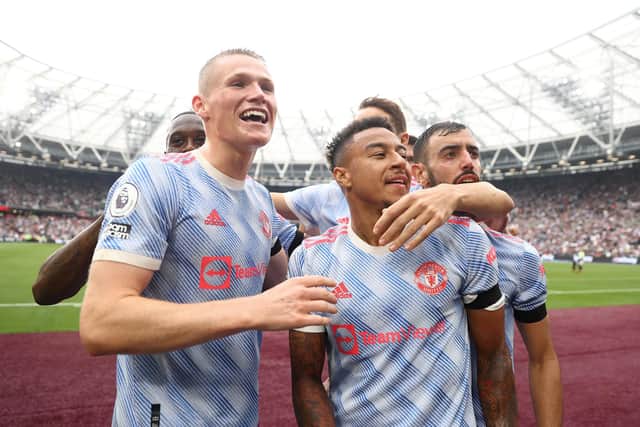 Jesse Lingard of Manchester United celebrates with teammates after scoring their side's second goal during the Premier League match between West Ham United and Manchester United at London Stadium on September 19, 2021 in London, England. (Photo by Julian Finney/Getty Images)