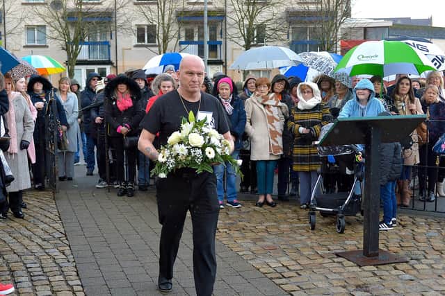 2020: A representative of the Stardust families (Dublin) lays a wreath at the annual service at the Bloody Sunday Memorial, Rossville Street. DER0620GS - 016